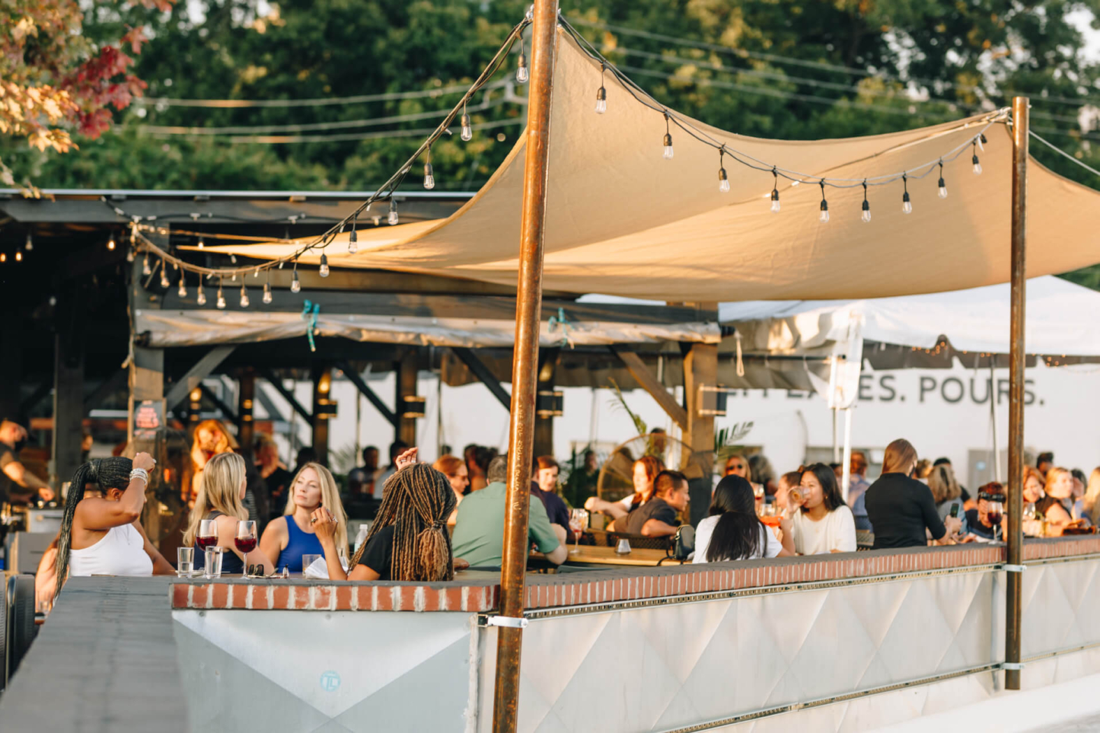 A full patio on a beautiful sunny day at Wye Hill Brewing in Downtown Raleigh
