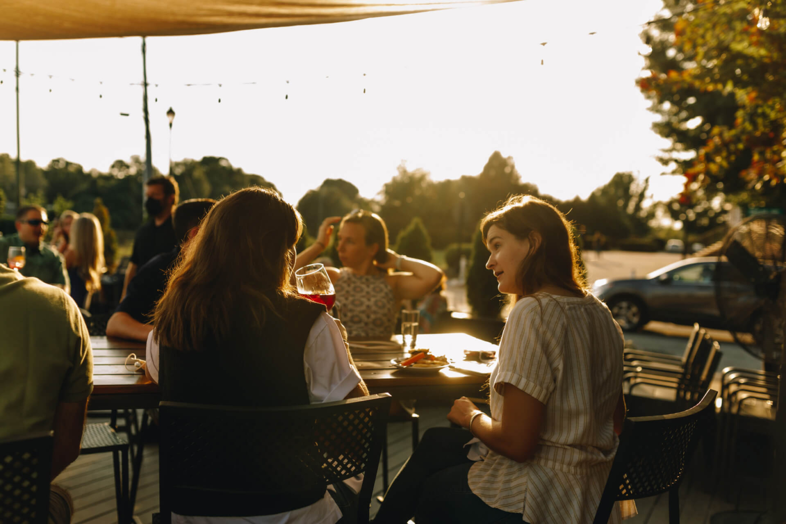 Friends enjoying dinner with a view on the patio at Wye Hill Kitchen & Brewing